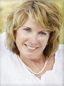 Smiling woman with successful tooth replacement teeth in Meridian ID